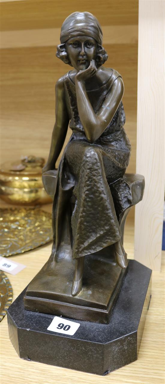After Moreau. An Art Deco style bronze figure of a seated flapper, on marble plinth, height 37cm